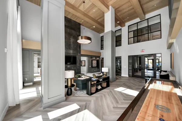 a view of a dining room kitchen with furniture and wooden floor