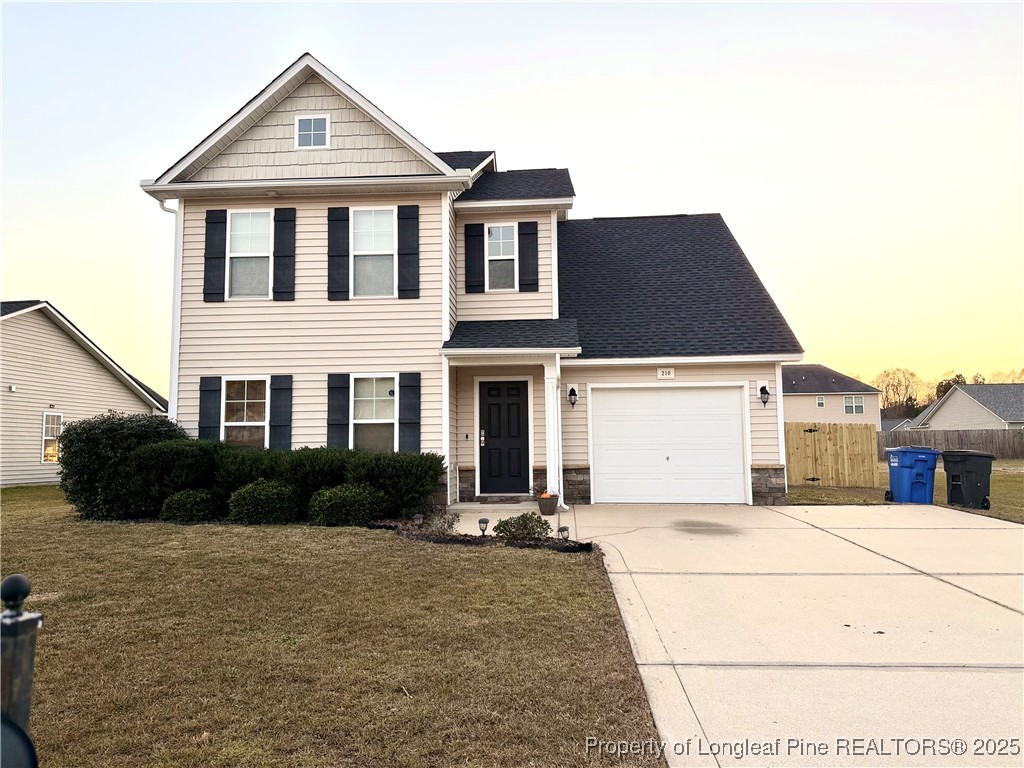 210 Roanoke Drive Raeford, NC 28376 - Photo 1 of 29 a front view of a house with a yard
