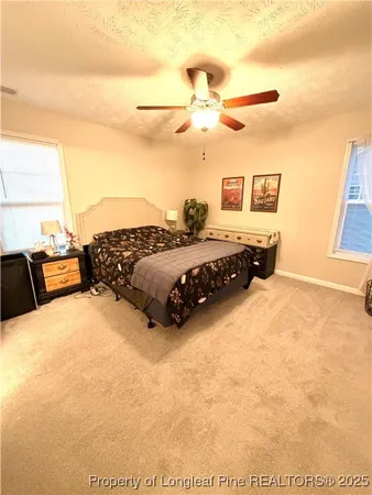 a bed room with a bed and a night stand