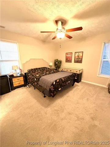 a bed room with a bed and a night stand