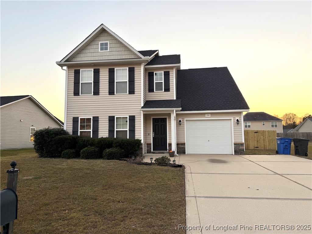 210 Roanoke Drive Raeford, NC 28376 - Photo 2 of 29 a front view of a house with a yard