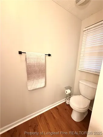 a bathroom with a toilet and a sink