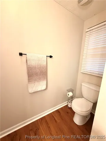 a bathroom with a toilet and a sink