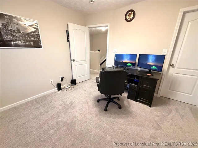 a workspace with furniture and window