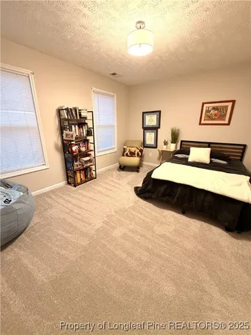 a bedroom with a bed and a cabinets