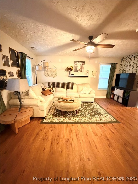 210 Roanoke Drive Raeford, NC 28376 - Photo 6 of 29 a living room with furniture and a flat screen tv