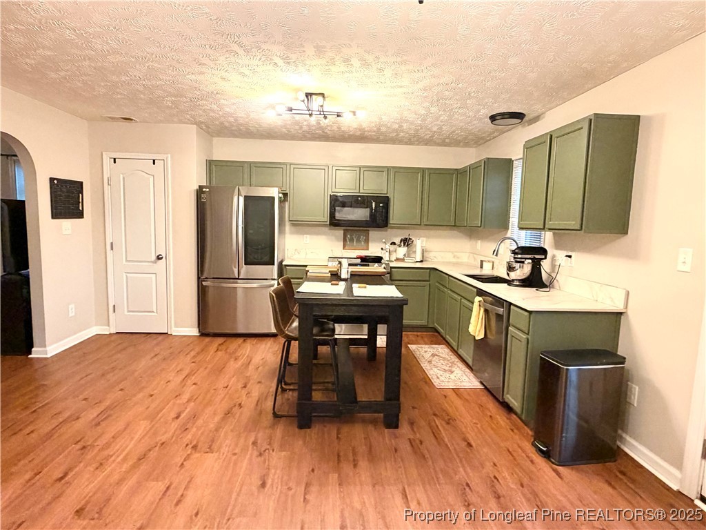 210 Roanoke Drive Raeford, NC 28376 - Photo 8 of 29 a kitchen with a sink appliances and cabinets
