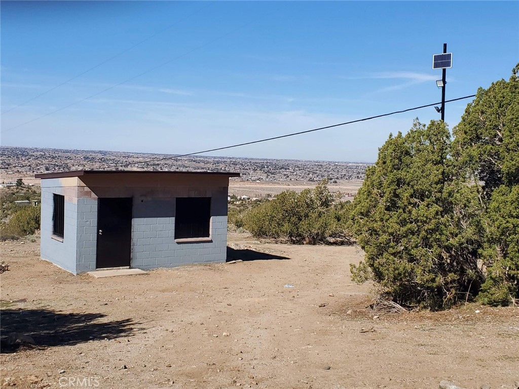 7380 High Hill Road Apple Valley, CA 92308 - Photo 3 of 3 a view of a house with a snow in the yard