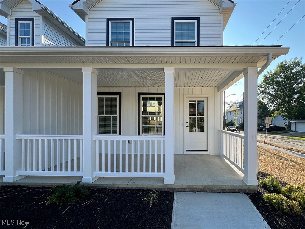 3630 Menlo Road Shaker Heights, OH 44120 - Photo 2 of 26 Entrance to property featuring covered porch and board and batten siding located on corner lot