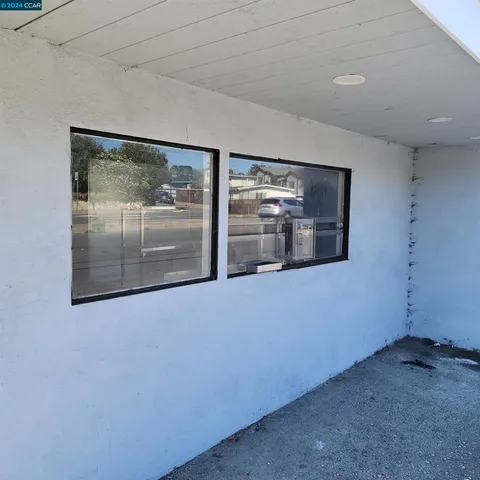 a view of hallway with a large window