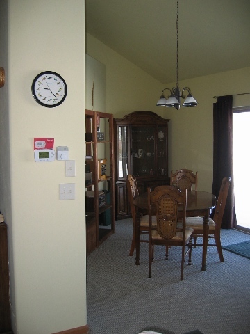 407 Kismet Street Ridgway, CO 81432 - Photo 5 of 6 a view of a dining room with furniture and a chandelier