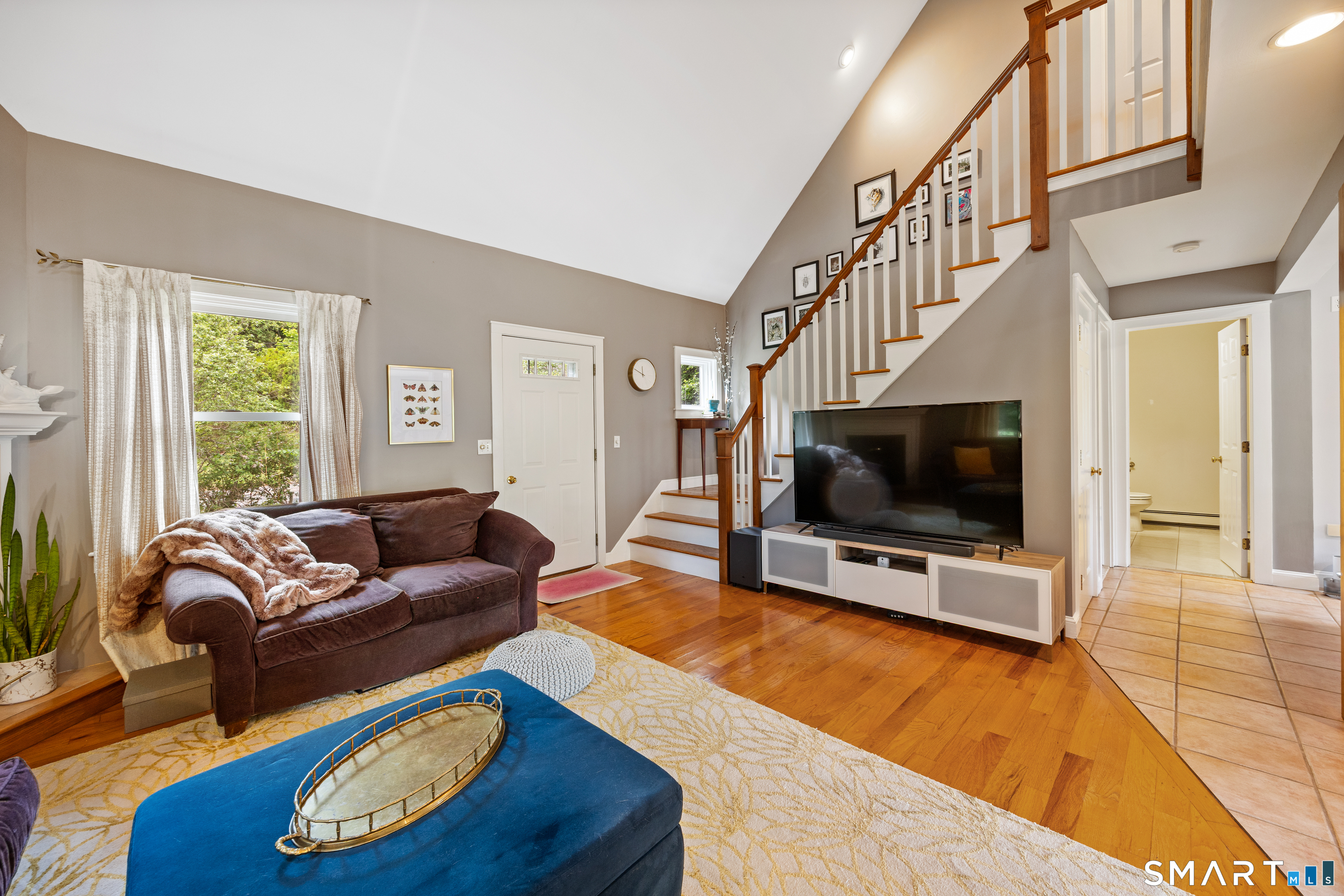 694 Millbrook Road Middletown, CT 06457 - Photo 4 of 34 a living room with furniture and a flat screen tv
