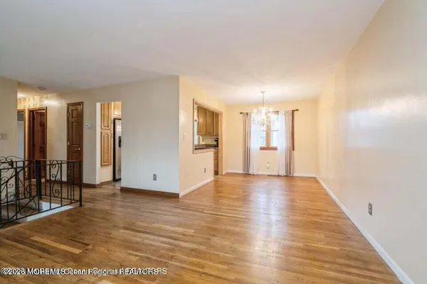 a view of an empty room with glass door