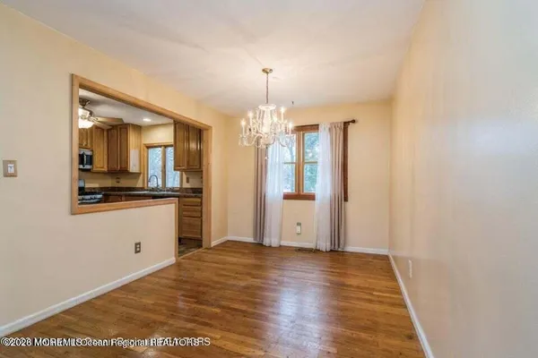 a view of a kitchen cabinets and wooden floor