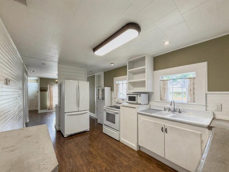 383 North Booker Street Crestview, FL 32536 - Photo 17 of 36 a kitchen with a refrigerator and a sink