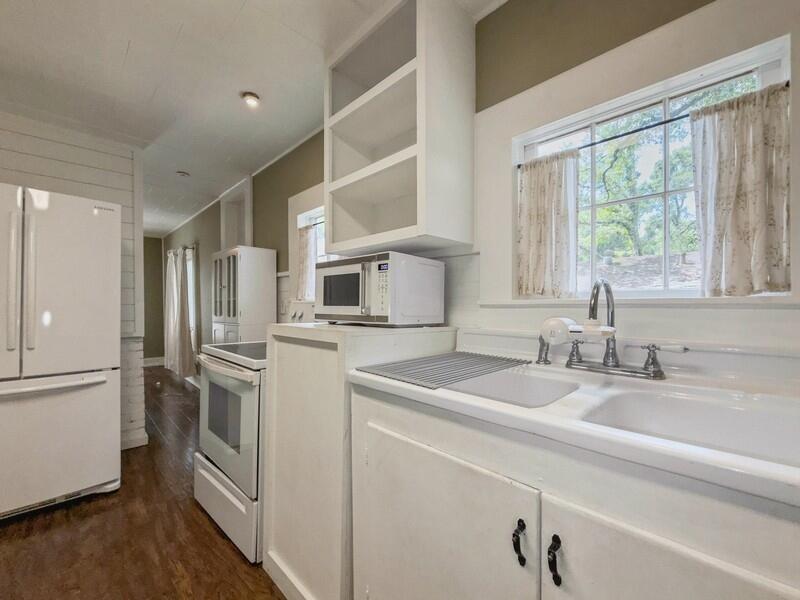 383 North Booker Street Crestview, FL 32536 - Photo 18 of 36 a kitchen with stainless steel appliances granite countertop a refrigerator and a sink