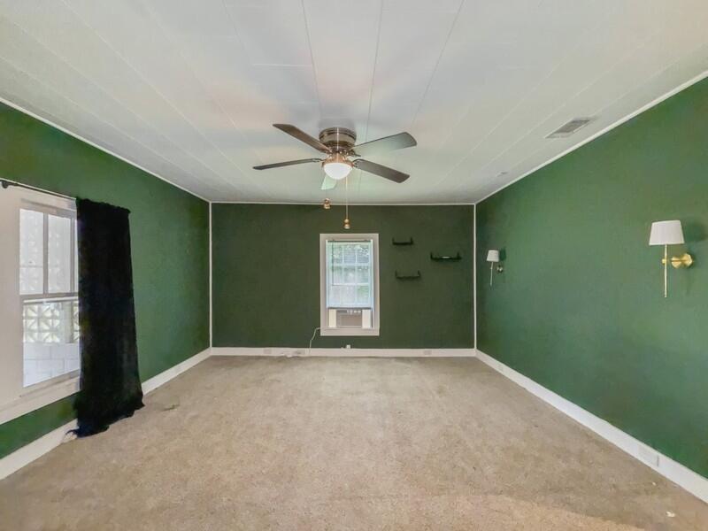 383 North Booker Street Crestview, FL 32536 - Photo 19 of 36 a view of an empty room with window and cabinet
