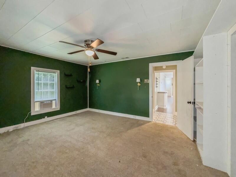 383 North Booker Street Crestview, FL 32536 - Photo 20 of 36 a view of a livingroom with a chandelier fan and windows