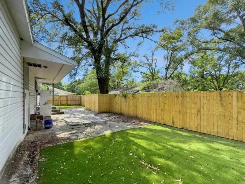 383 North Booker Street Crestview, FL 32536 - Photo 30 of 36 a view of a backyard with large tree