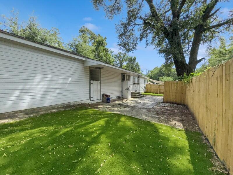 383 North Booker Street Crestview, FL 32536 - Photo 31 of 36 a backyard of a house with table and chairs