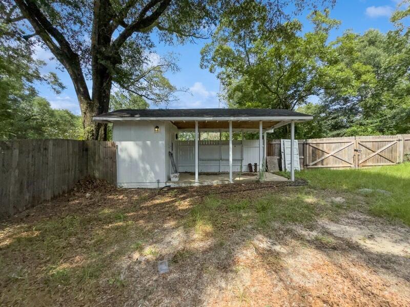383 North Booker Street Crestview, FL 32536 - Photo 34 of 36 a view of a house with a yard