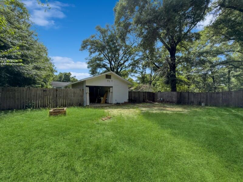 383 North Booker Street Crestview, FL 32536 - Photo 35 of 36 a backyard of a house with seating space