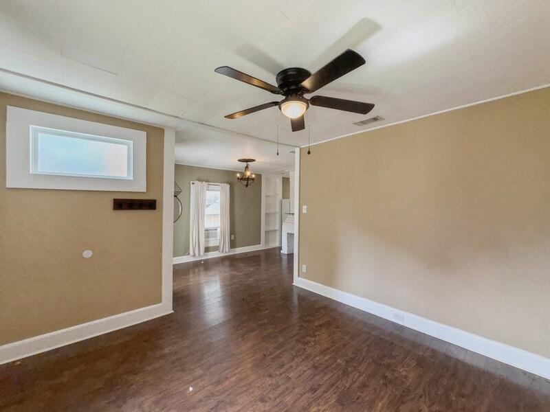 383 North Booker Street Crestview, FL 32536 - Photo 3 of 36 a view of an empty room and wooden floor