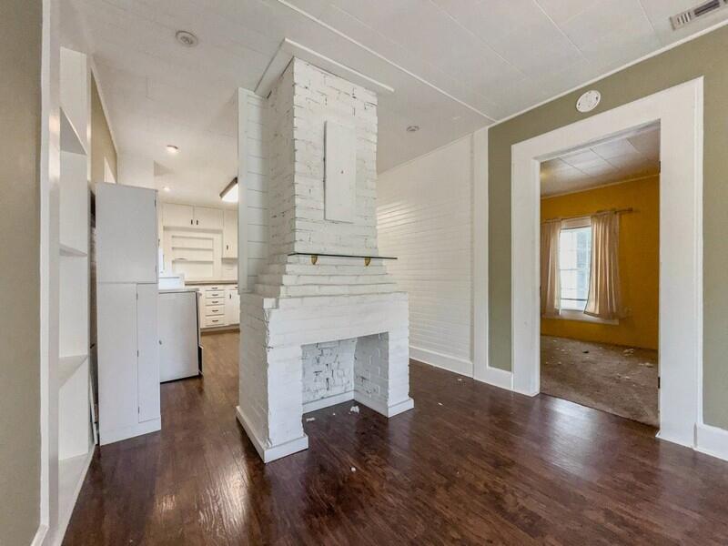 383 North Booker Street Crestview, FL 32536 - Photo 7 of 36 a view of a hallway with wooden floor and staircase