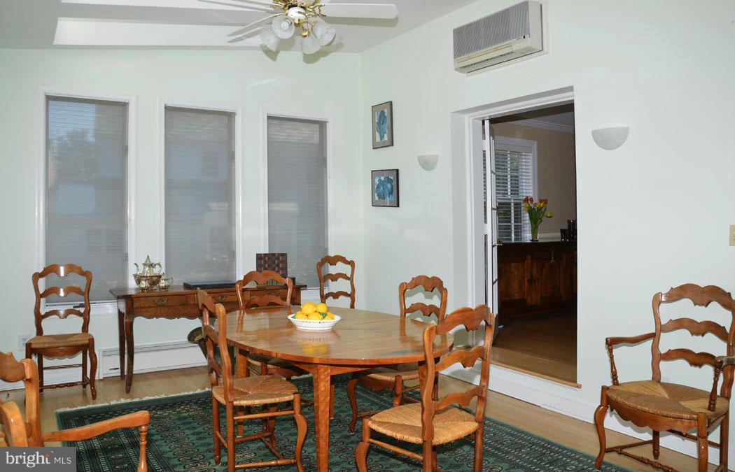 5603 Ridgefield Road Bethesda, MD 20816 - Photo 11 of 30 a view of a dining room with furniture and chandelier
