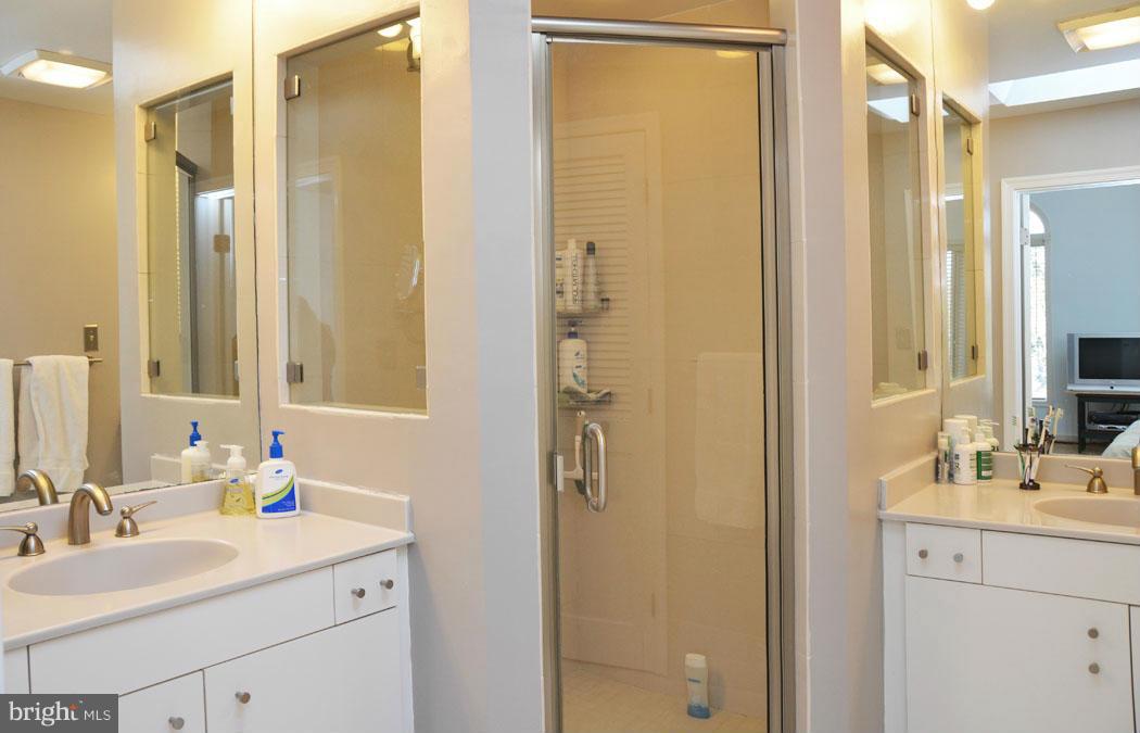5603 Ridgefield Road Bethesda, MD 20816 - Photo 26 of 30 a bathroom with a sink and a mirror