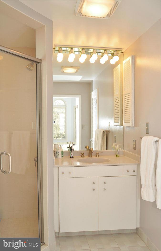 5603 Ridgefield Road Bethesda, MD 20816 - Photo 27 of 30 a bathroom with a double vanity sink mirror and double