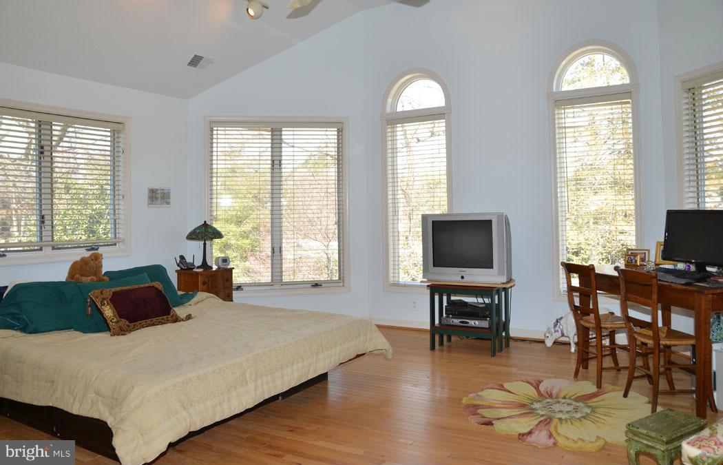 5603 Ridgefield Road Bethesda, MD 20816 - Photo 28 of 30 a bedroom with a bed and large windows