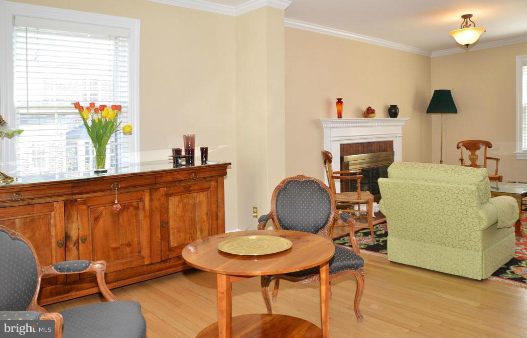 5603 Ridgefield Road Bethesda, MD 20816 - Photo 8 of 30 a living room with furniture a piano and a flat screen tv