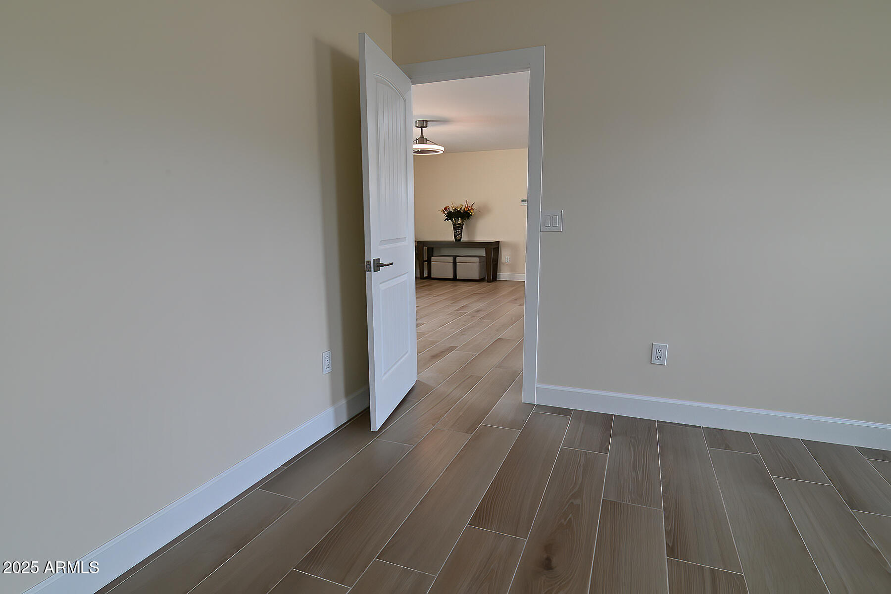 20214 East Mesa Verde Road Mayer, AZ 86333 - Photo 10 of 26 a view of a hallway view with wooden floor and a bathroom