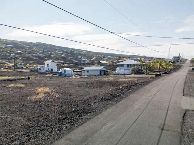 an aerial view of houses with outdoor space