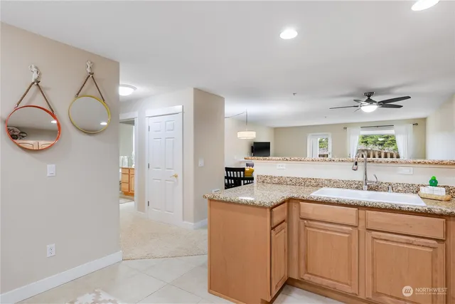 a kitchen with cabinets appliances and a sink