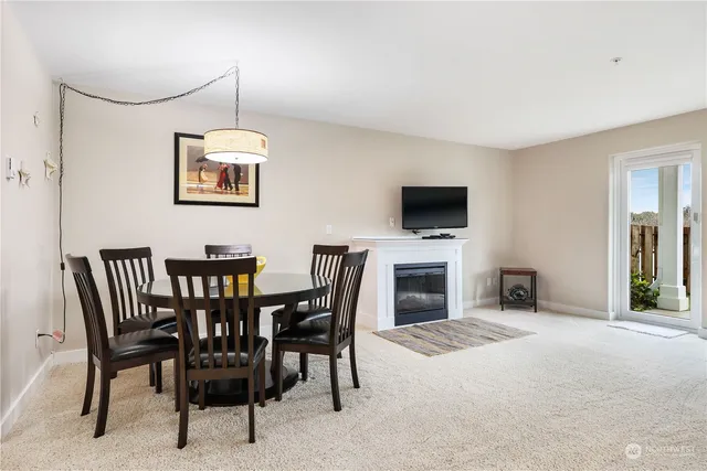 a view of a livingroom with furniture and a fireplace