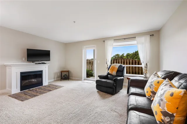 a bedroom with furniture and a fireplace