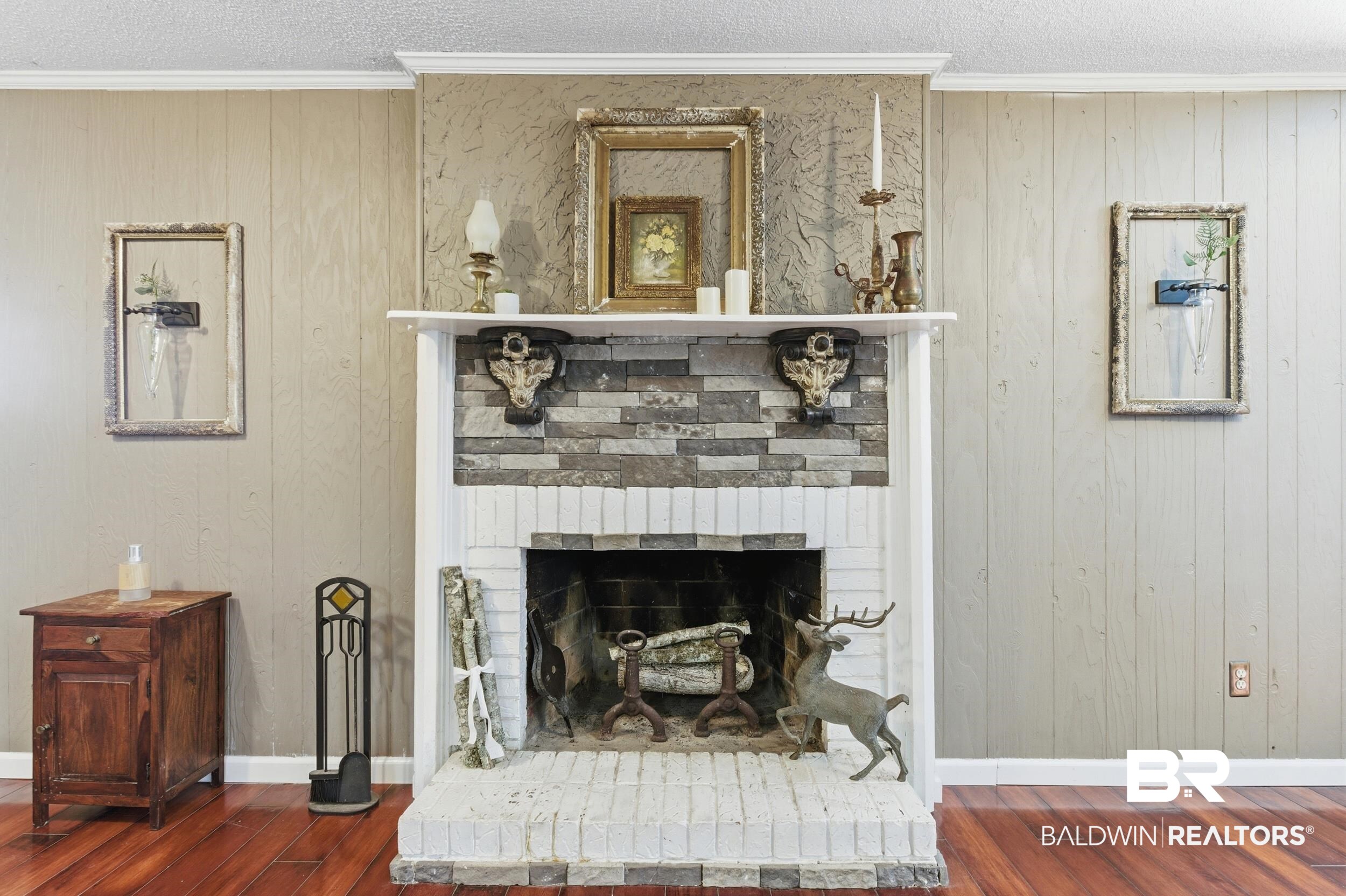 51620 Robert White Road Bay Minette, AL 36507 - Photo 21 of 81 Fireplace featuring a stone facade, a white mantel, and a brick hearth