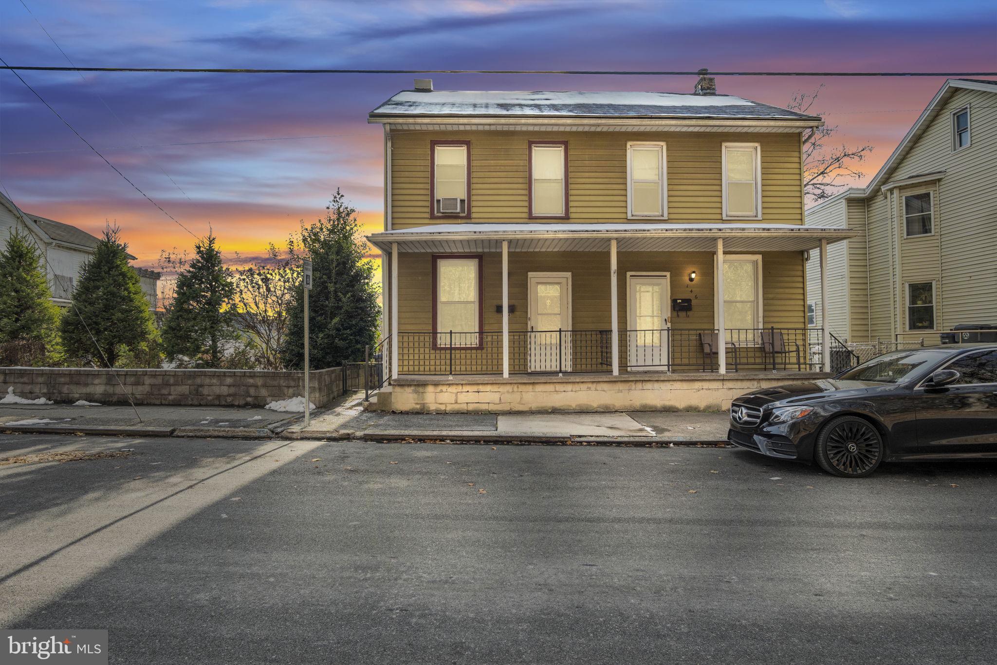 144 North 2nd Street Steelton, PA 17113 - Photo 1 of 29 a car parked in front of a house