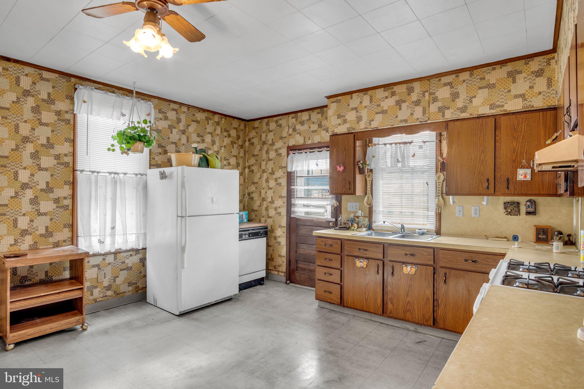 144 North 2nd Street Steelton, PA 17113 - Photo 11 of 29 a kitchen with refrigerator and cabinets
