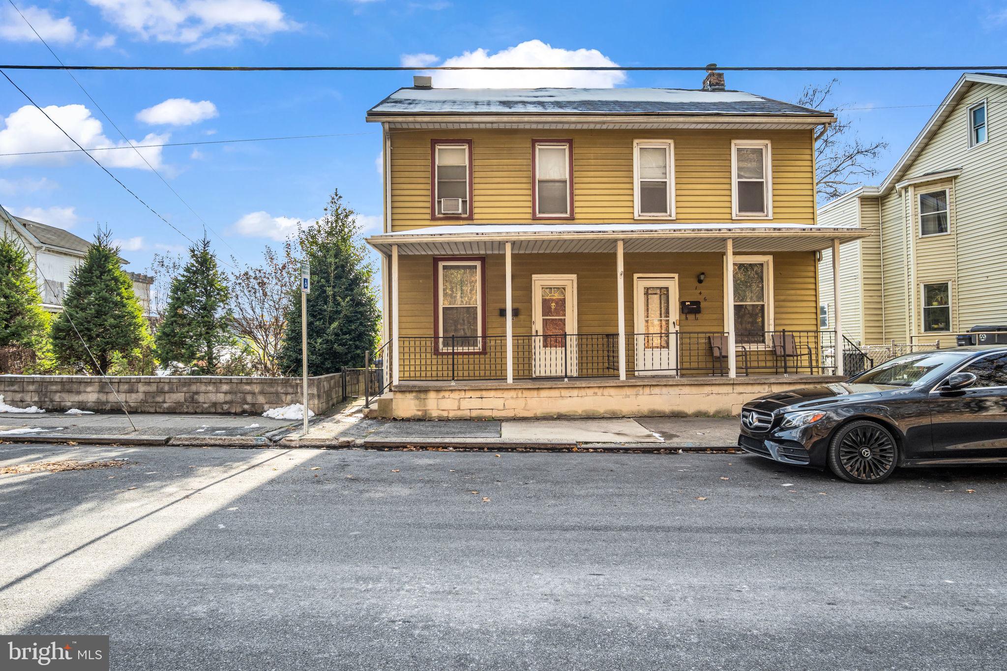 144 North 2nd Street Steelton, PA 17113 - Photo 22 of 29 a car parked in front of a house