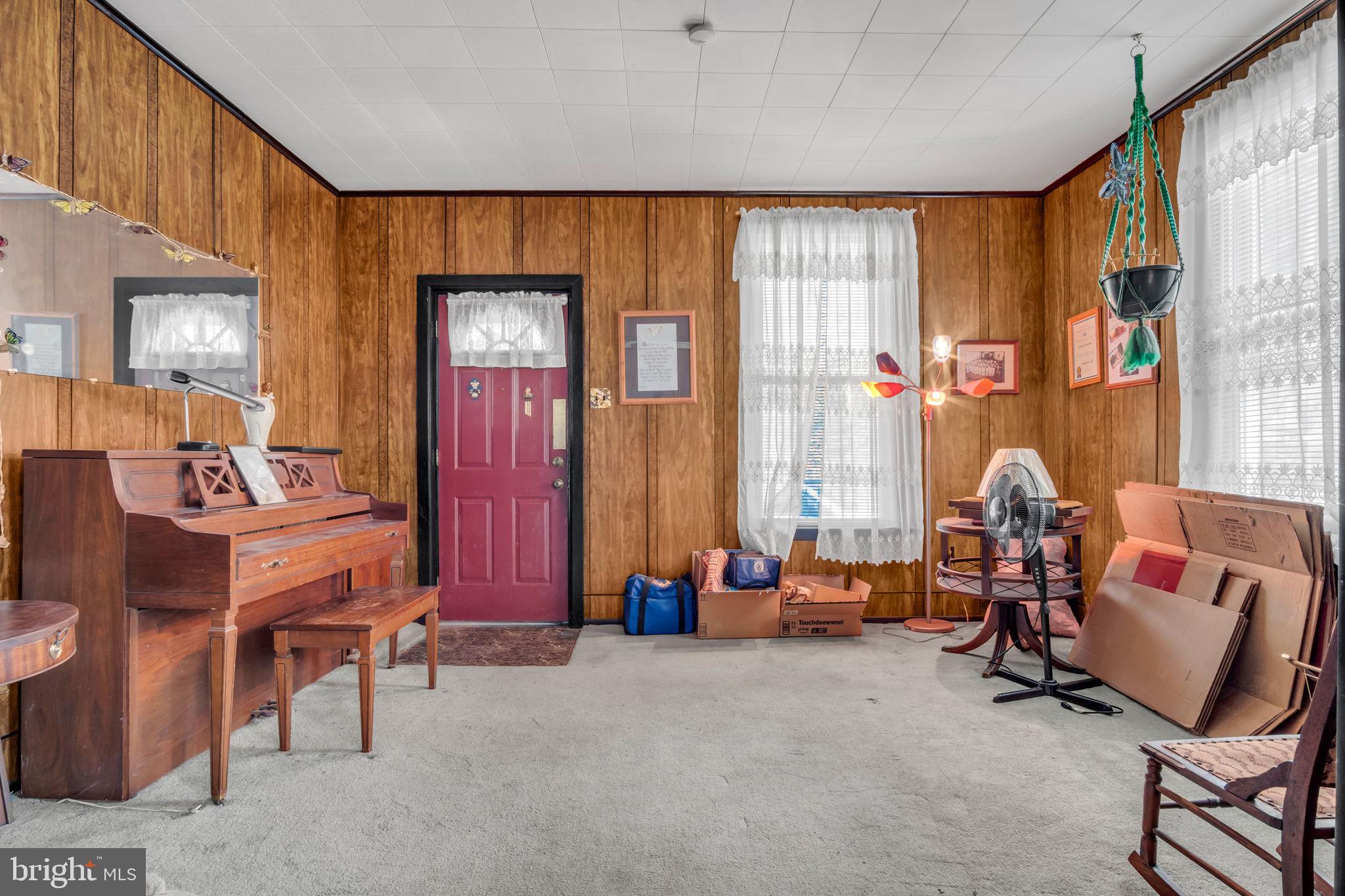 144 North 2nd Street Steelton, PA 17113 - Photo 7 of 29 a living room with furniture and a window