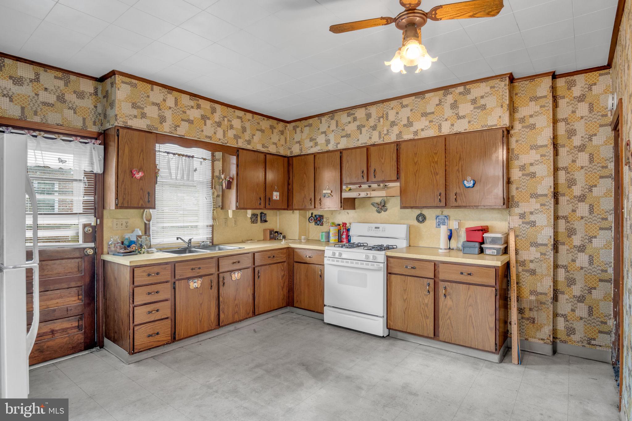 144 North 2nd Street Steelton, PA 17113 - Photo 10 of 29 a kitchen with sink cabinets and window