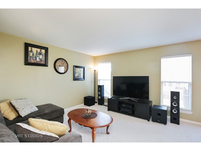 1069 Horizon Ridge Lake In The Hills, IL 60156 - Photo 3 of 10 a living room with furniture and a flat screen tv