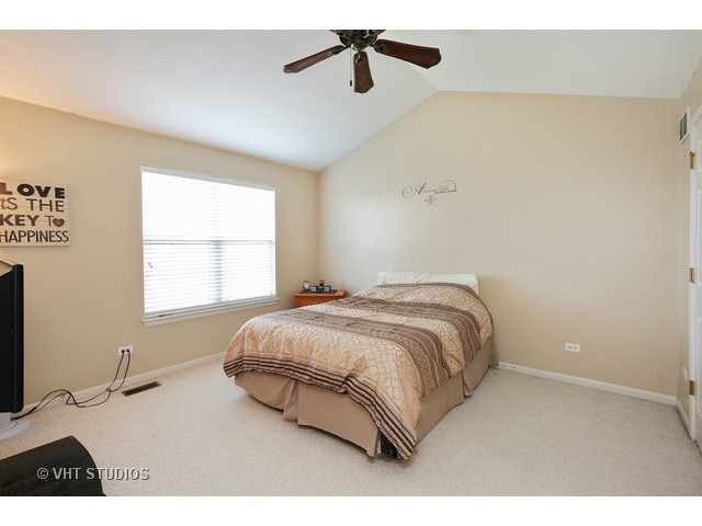 1069 Horizon Ridge Lake In The Hills, IL 60156 - Photo 7 of 10 a bedroom with a bed and two windows
