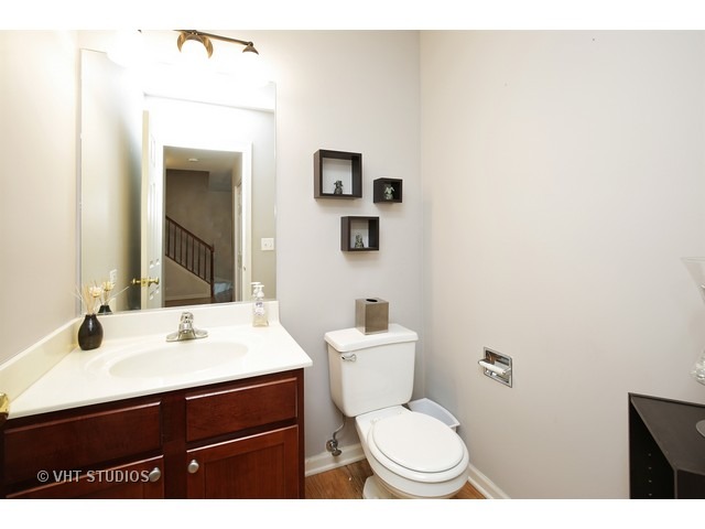 1069 Horizon Ridge Lake In The Hills, IL 60156 - Photo 10 of 10 a bathroom with a toilet sink vanity and mirror