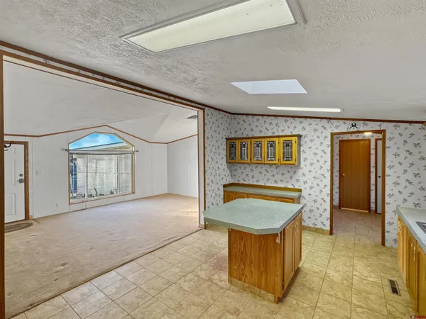 a bathroom with a sink mirror and shower