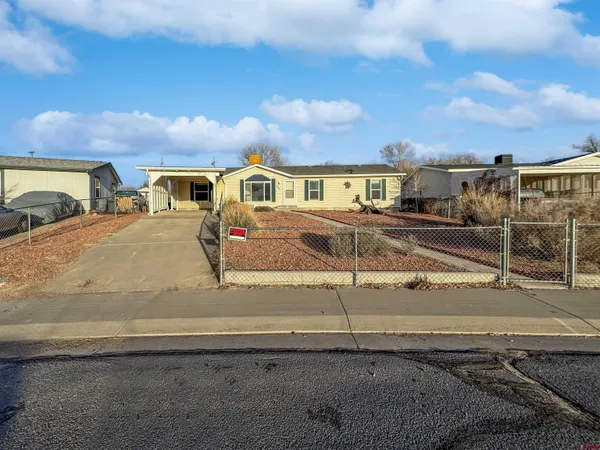 a view of a house with a street