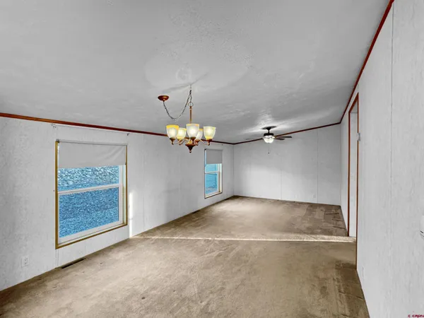 a view of entryway with wooden floor and cabinet